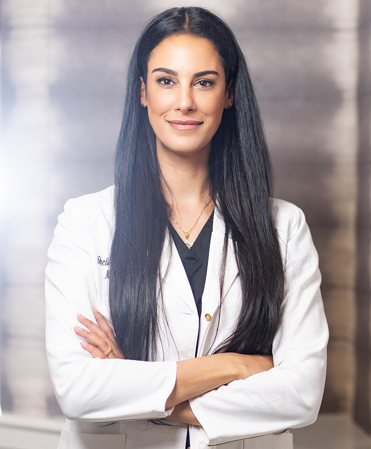 Serious professional in a white lab coat.