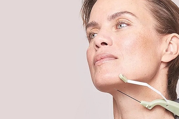 Woman undergoing cosmetic treatment or procedure.