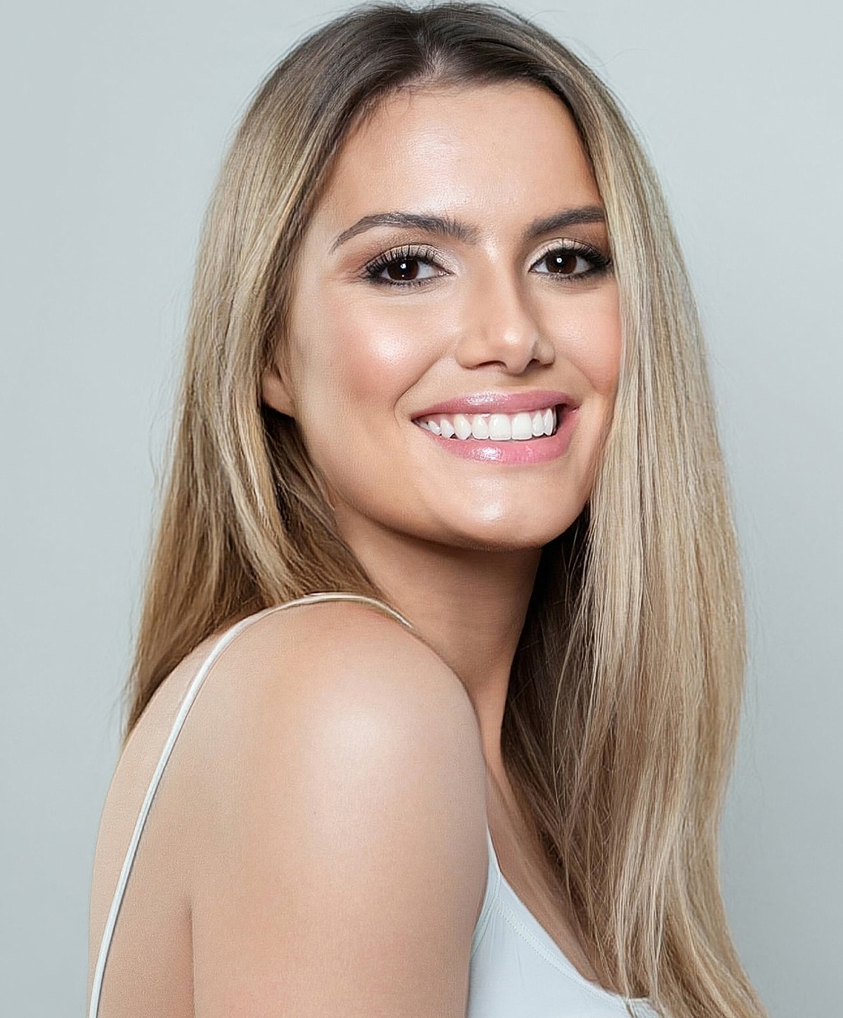 Close-up of a leg and hand in sunlight.