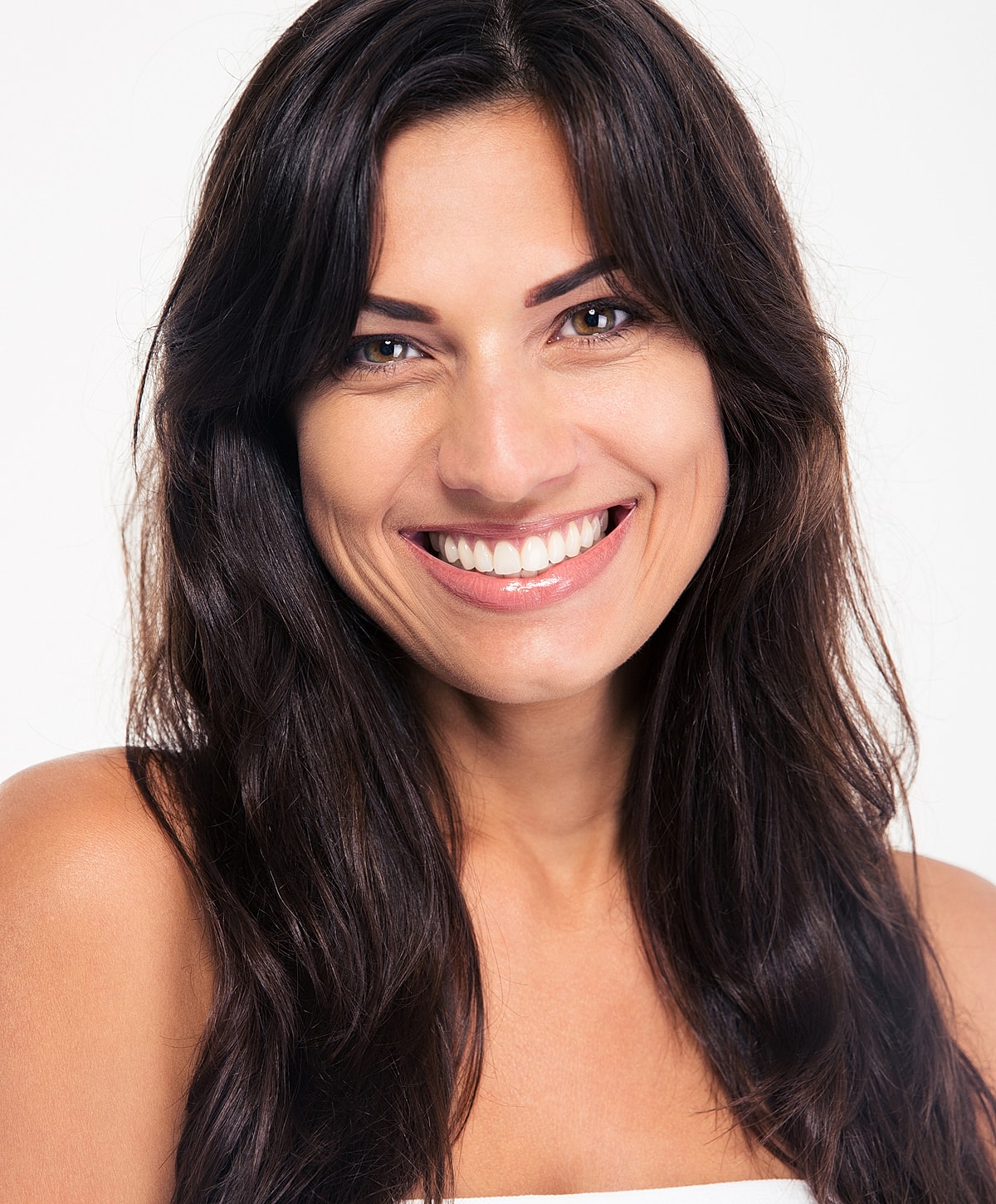 Woman walking up stairs in fitted jeans.
