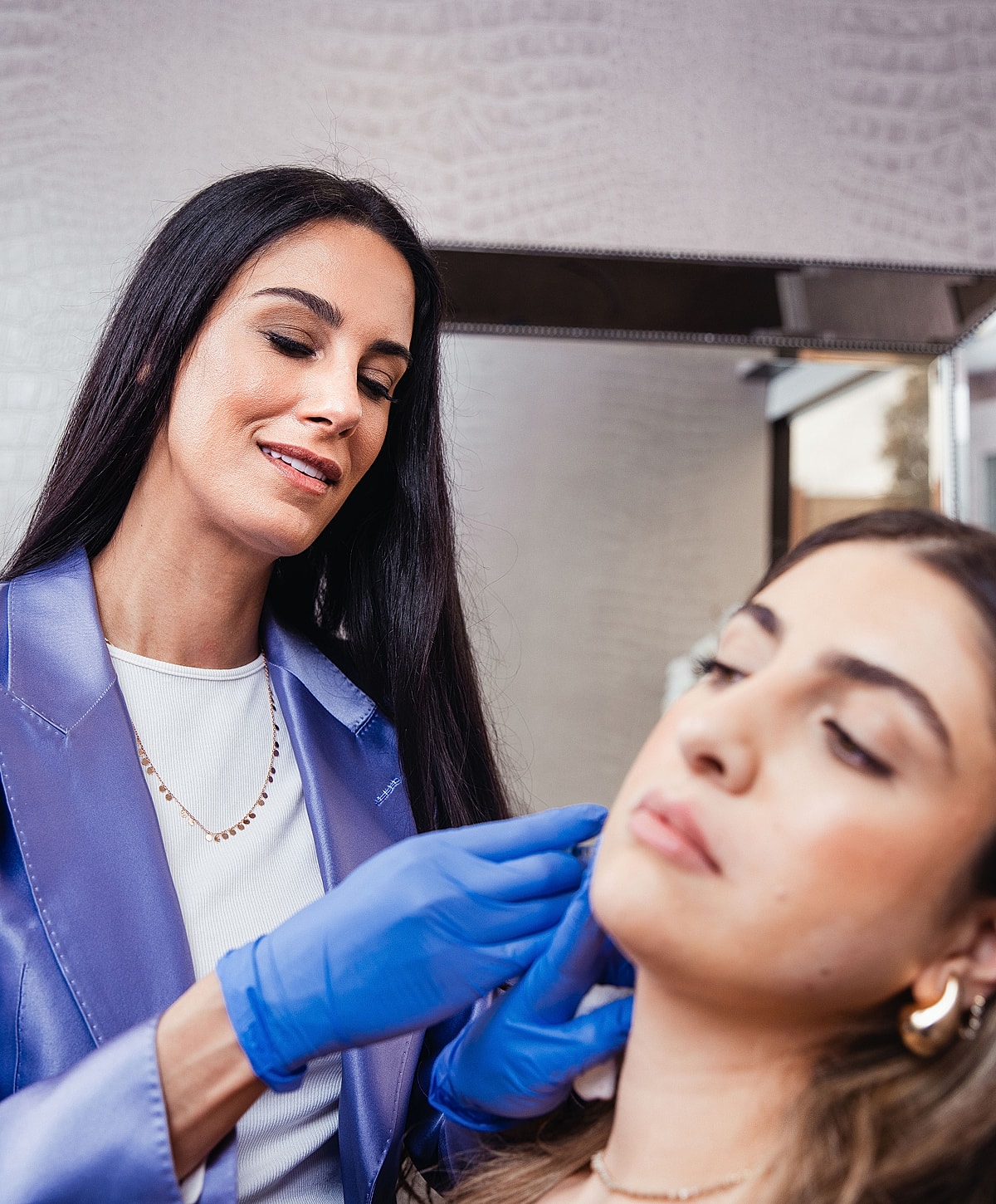 Medical professional applying treatment to a patient.