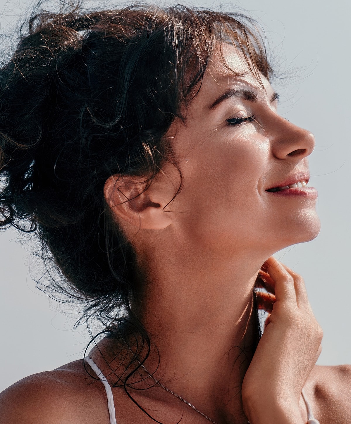 Woman in black leggings outdoors, focused on legs.