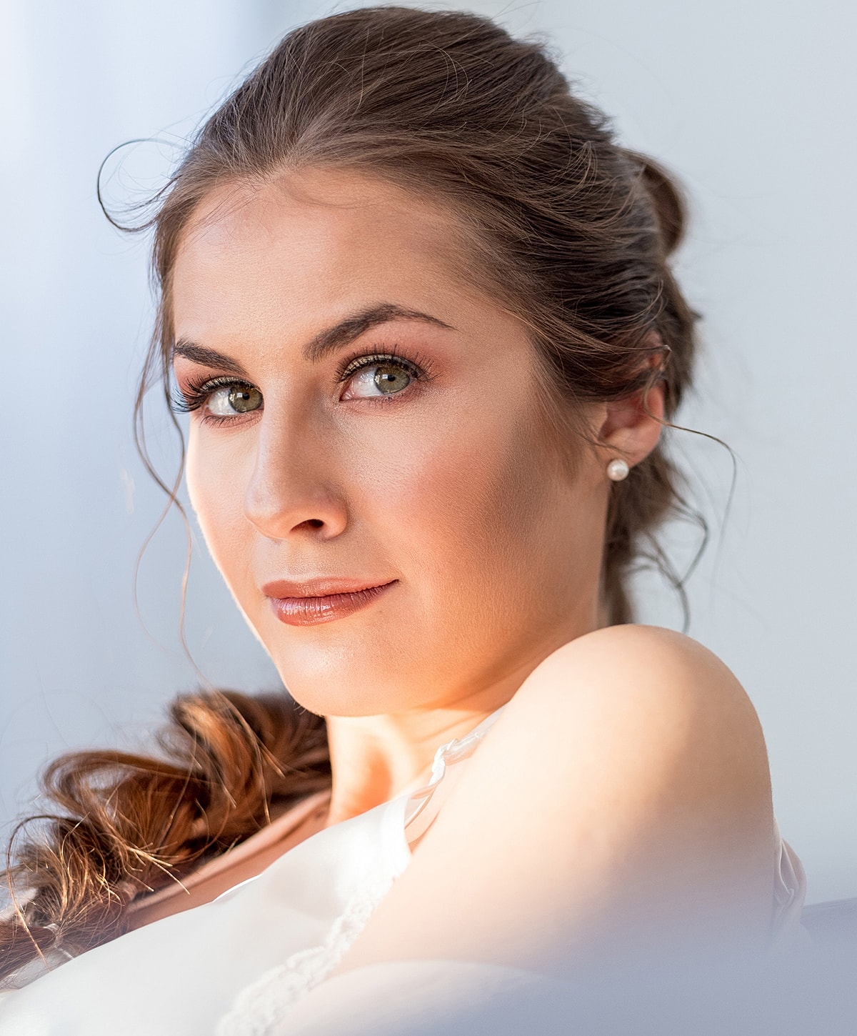Woman walking up stairs in fitted jeans.