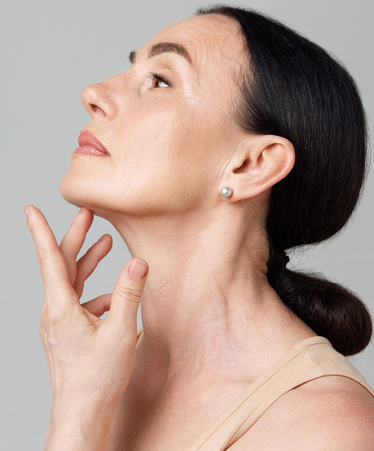 Woman in black leggings outdoors, focused on legs.