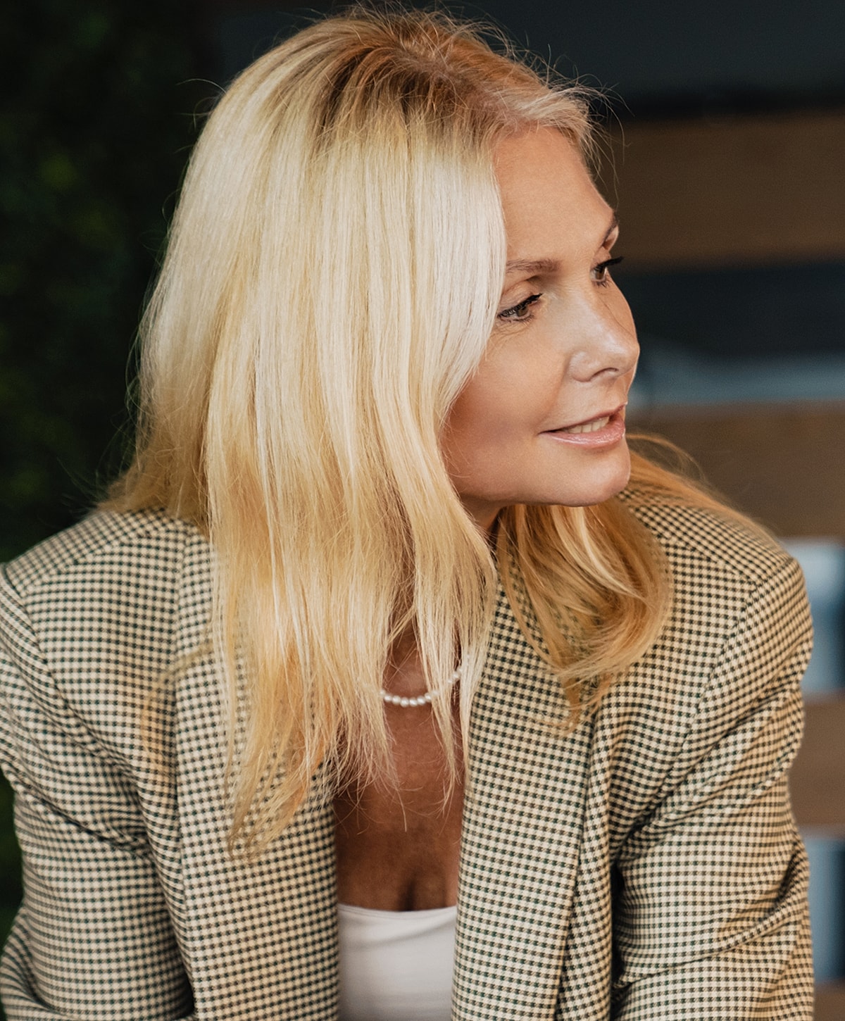 Woman walking up stairs in fitted jeans.