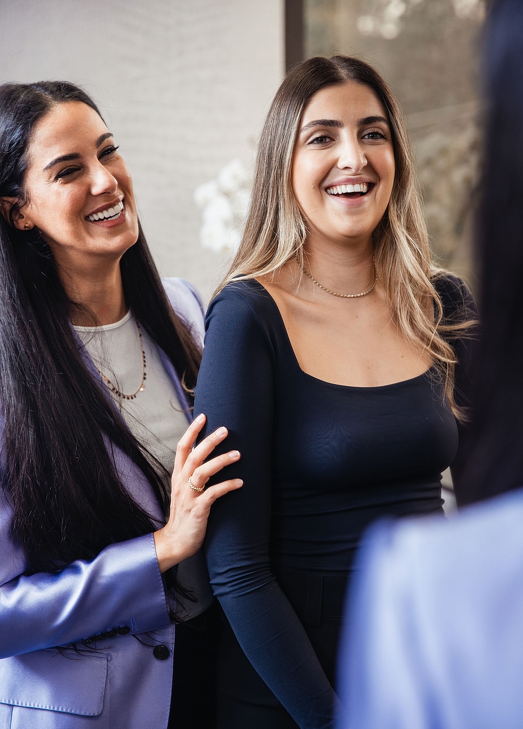 Woman in white dress with serene expression.