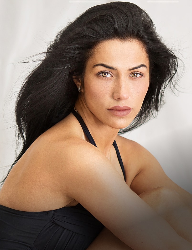 Woman in black leggings outdoors, focused on legs.