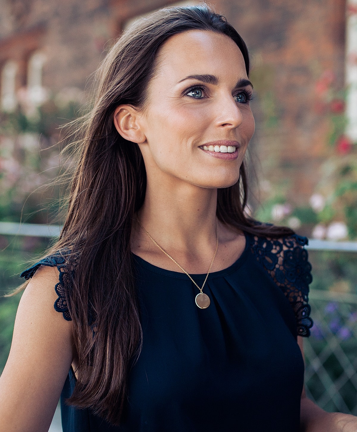 Woman in black leggings outdoors, focused on legs.