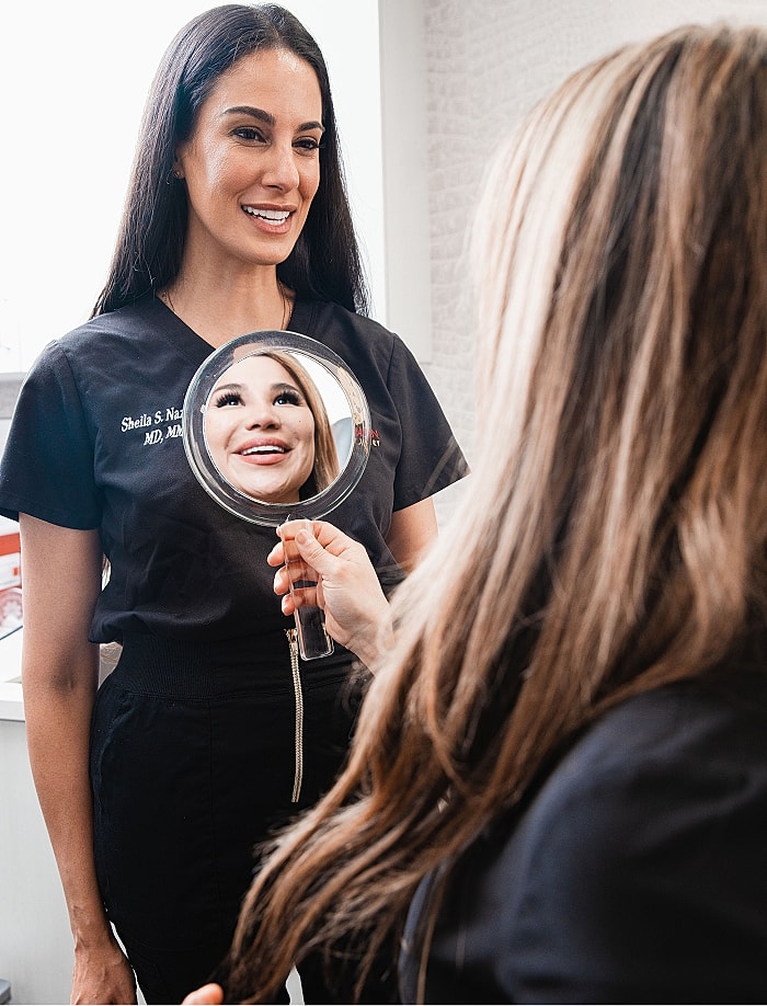 Patient consultation in a beauty or skincare setting.