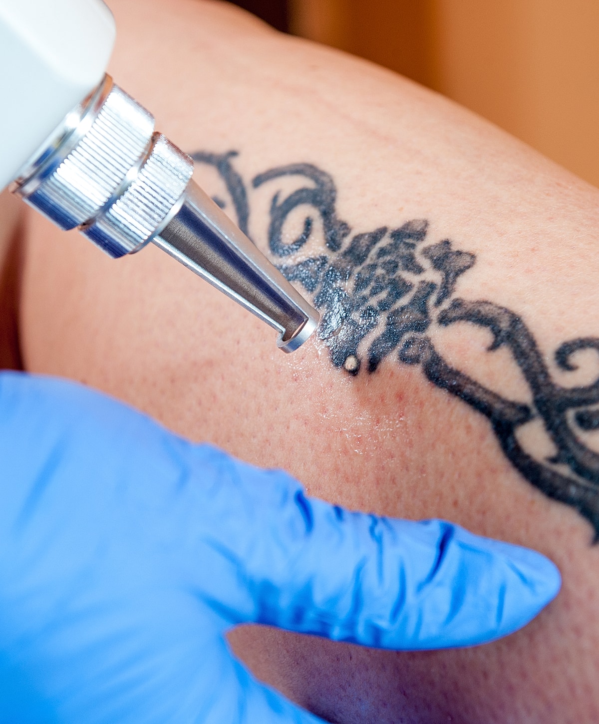 Woman walking up stairs in fitted jeans.