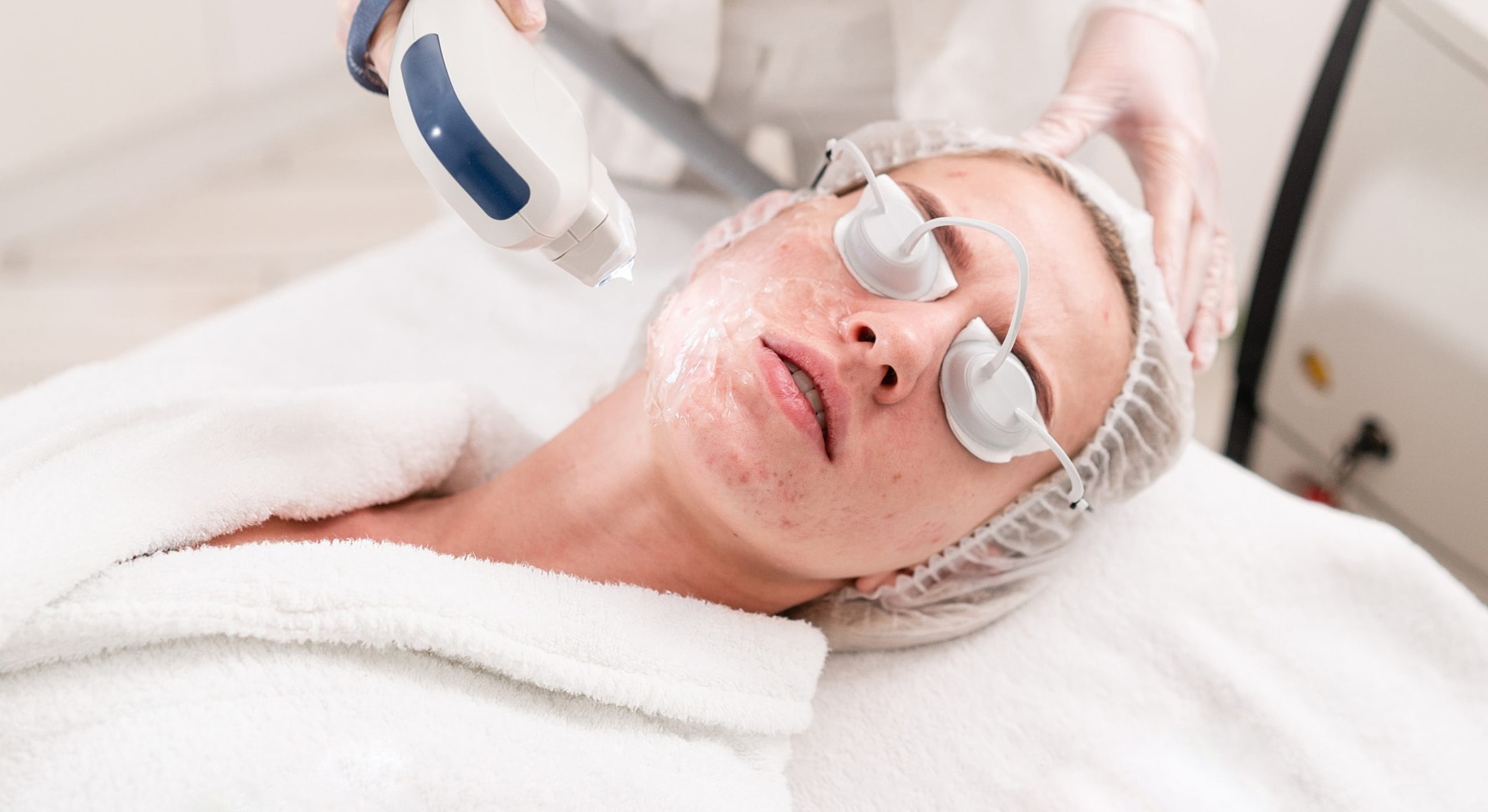 Facial treatment procedure in a spa setting.