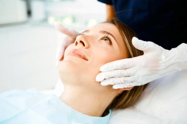 female patient experiencing smoother and brighter skin after chemical peel treatment